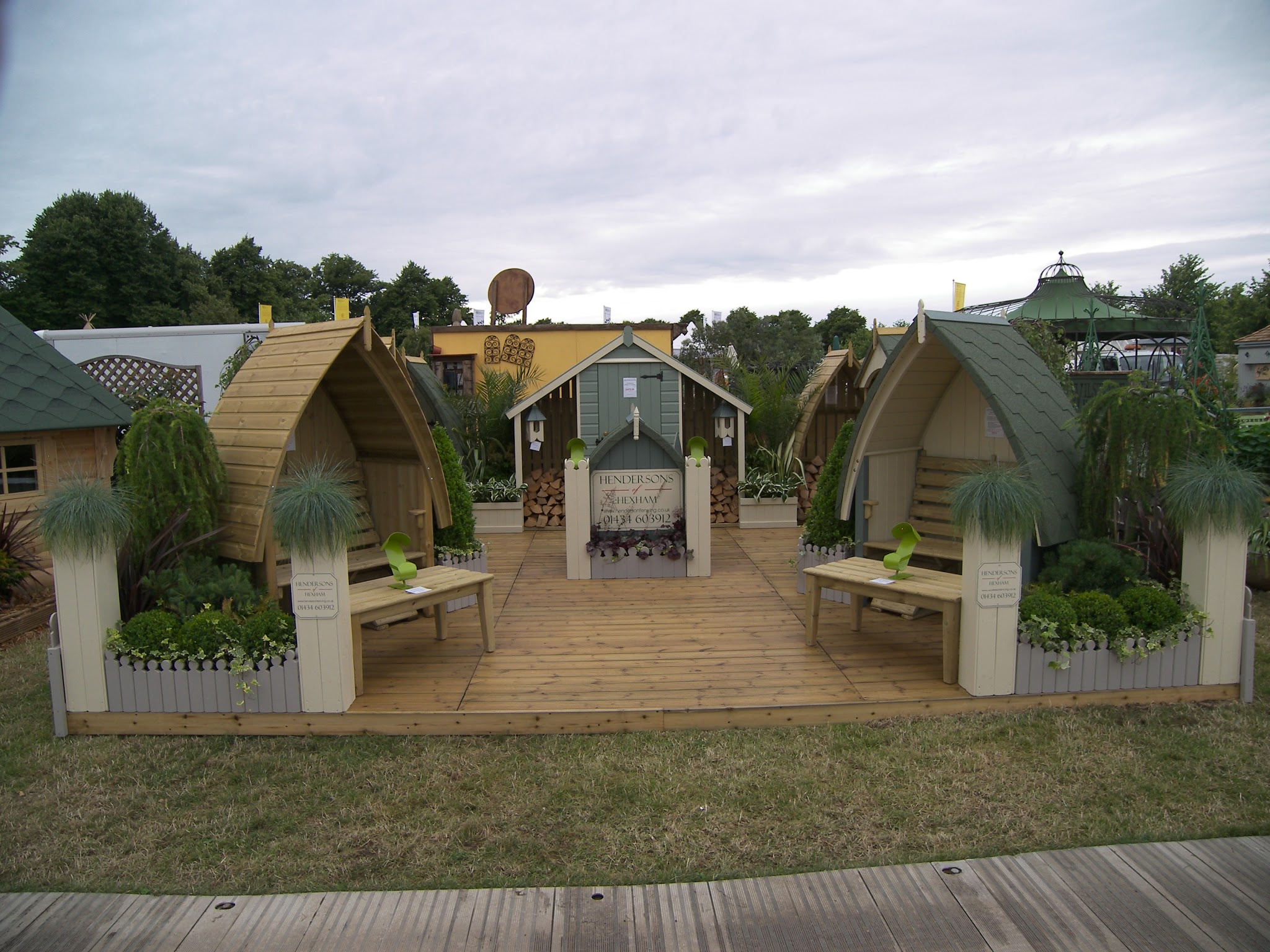 The Hendersons of Hexham show stand with arbour seats, log stores and the signwritten board