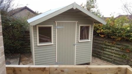 Sage apex shed with cream windows