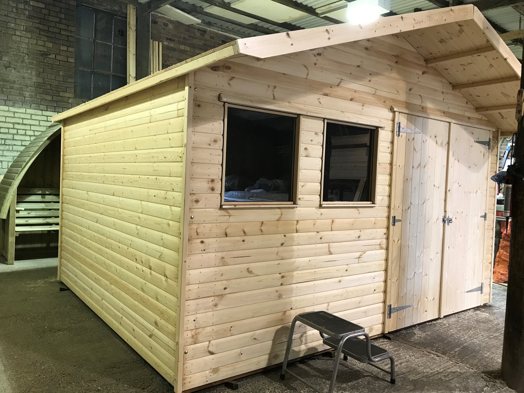 A new untreated shed being finished inside the Hendersons workshop